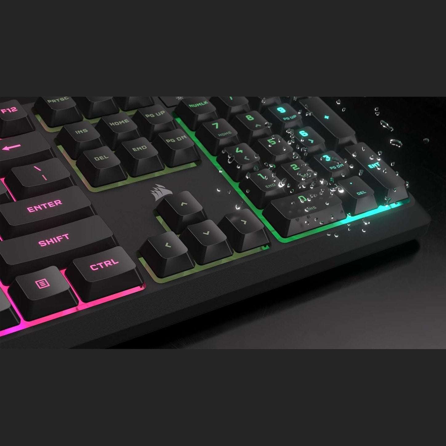 Close-up of black Corsair K55 CORE RGB membrane keyboard keys with multicolor lighting