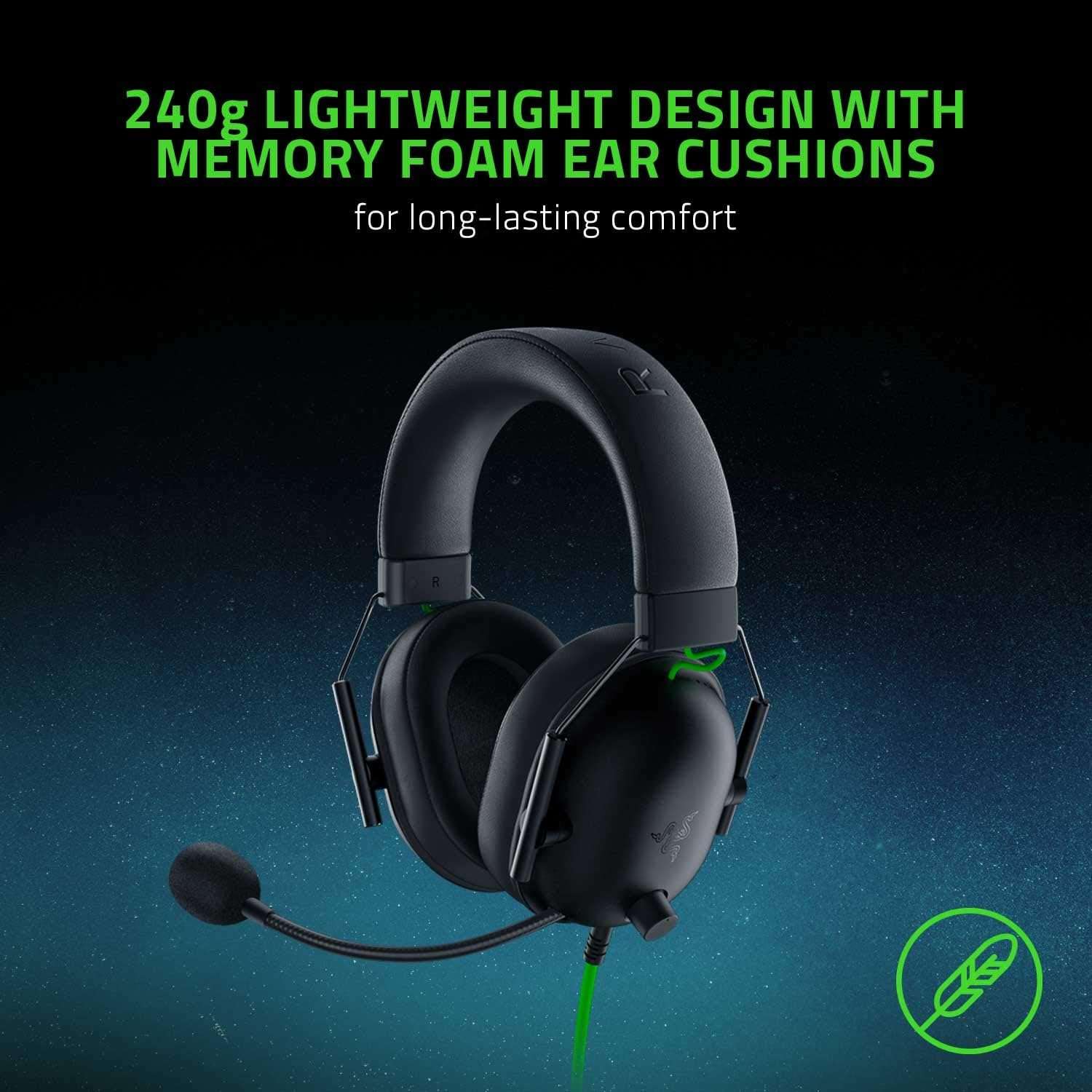Black over-ear gaming headset with thick padded ear cushions and green cable
