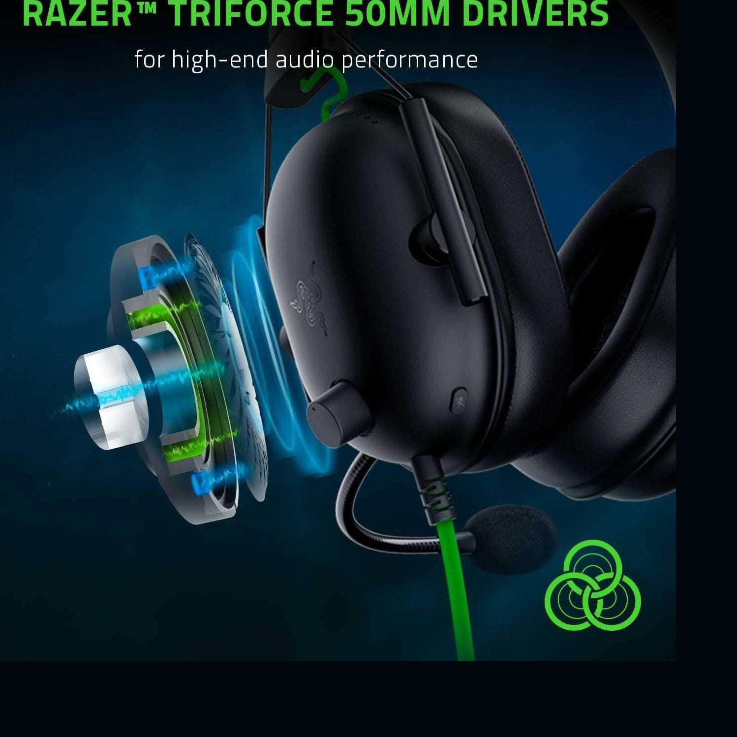 Black gaming headset earcup close-up with green cable and boom mic